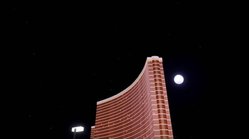 A full moon and stars in the night sky over the Las Vegas Strip Circuit